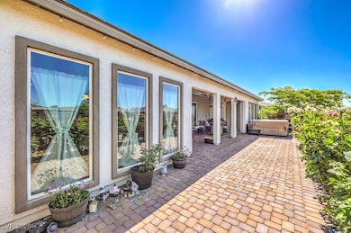 View of patio / terrace featuring a hot tub