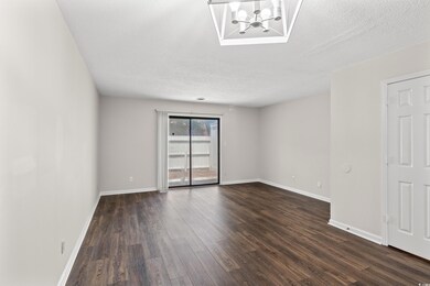 Unfurnished room featuring an inviting chandelier,