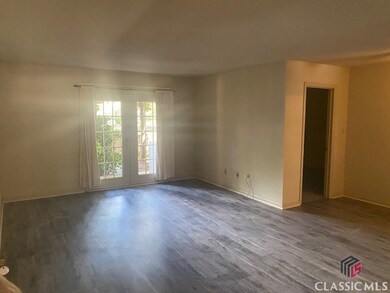 Living Room - New Flooring. French doors to covered patio.