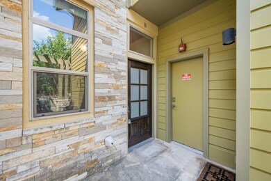 View of exterior entry with stone siding