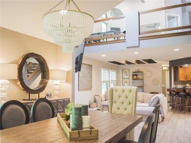 Dining area featuring a chandelier, light hardwood