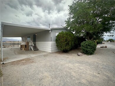View of property exterior with a carport