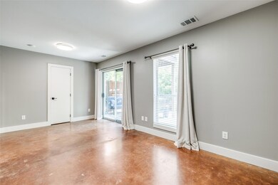 Oversized first floor bedroom with concrete floori