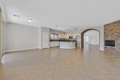 Unfurnished living room with arched walkways, base