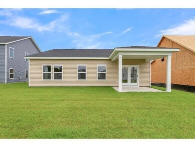 Rear view of property featuring french doors and a