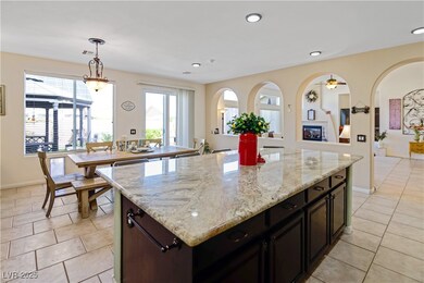 Kitchen featuring light tile patterned floors, a h