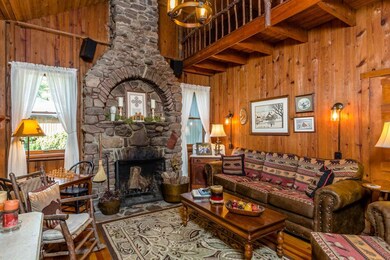 Soaring 17-foot ceilings and wood-burning stone fi