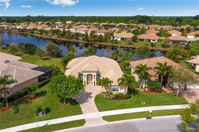 Beautiful roof lines on this lakefront home enhanc