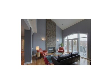 Living Room features Stacked Stone See-Through Fir