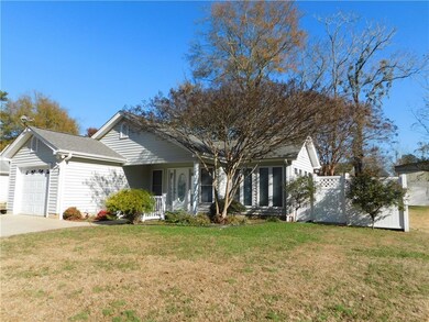 Nice yard with mature Myrtles & Rose bushes.