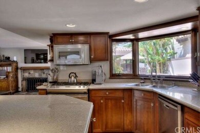 Kitchen looking toward living room with view of ou