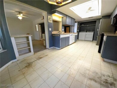 Kitchen with washer and clothes dryer, dishwasher,