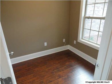 Nice study off of the foyer with hardwood floors.