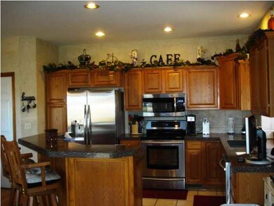 Kitchen with new appliances & granite counter tops.