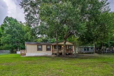 Check out this close-up view of the front of this home.  Beautiful mature hardwoods give plenty of shade in the summer months.