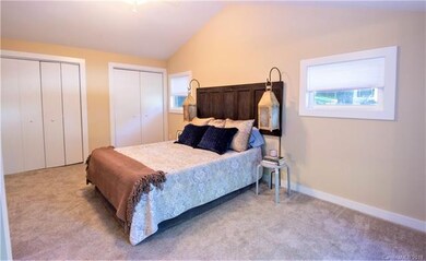 master bedroom with cathedral ceiling