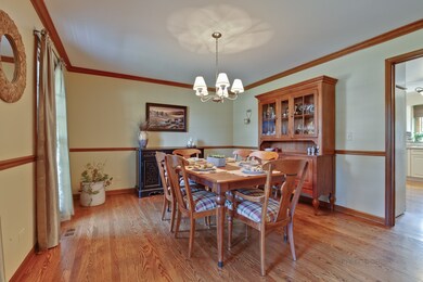 Dining Room features crown molding and chair rail