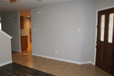View from inside formal of Entry and Kitchen. Great wall space for art or entry table!