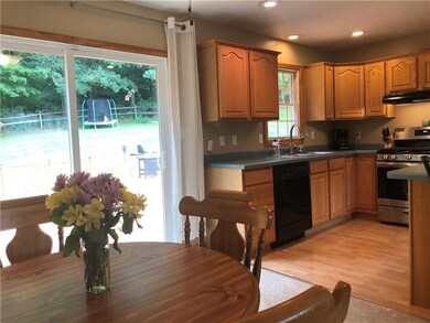 Adjoining Dining Room leads to oversized back deck