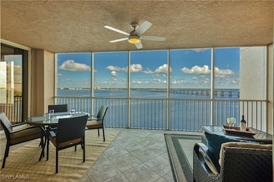 Sunroom / solarium featuring ceiling fan and a wat