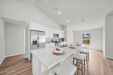 Kitchen with light wood-type flooring, white cabin