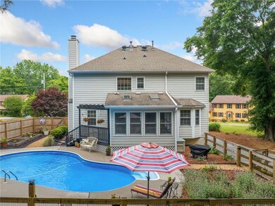 Rear view of property featuring a patio area, a ch