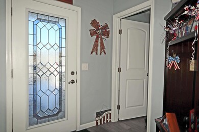 Foyer with leaded glass door