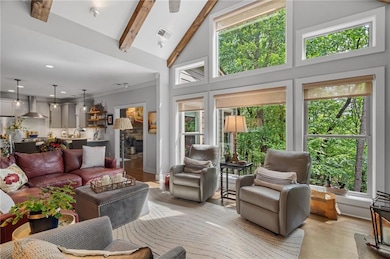 Living area featuring healthy amount of natural light and light wood-type flooring