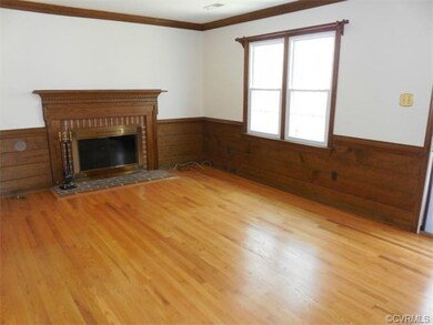 Family Room with hardwood floor and wood-burning f