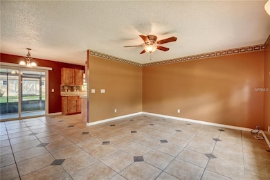Living Room view into kitchen/dining/back screen porch