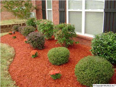 PROFESSIONALLY LANDSCAPED FRONT ENTRANCE.