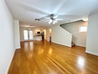 Spacious living room and hard wood floors.