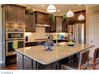 Kitchen - This picture is not the subject property. The subject property is to be built. The picture may show optional features, not included in the list price.