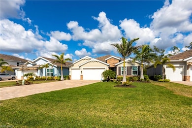 Ranch-style house with a garage and a front yard