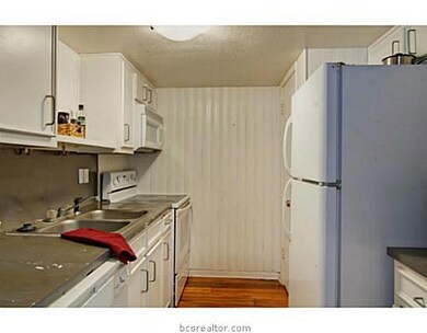Kitchen. The kitchen features ample cabinet space,