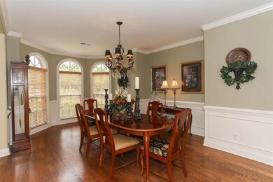 Dining Room has unique curved window wall looking 