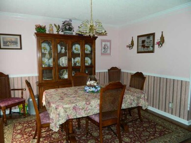 Formal Dining Room w/ Hardwood Flooring & Crown Molding