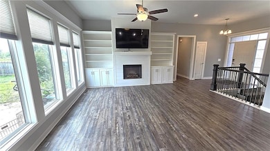 Main level - Family Room fireplace with oversized windows