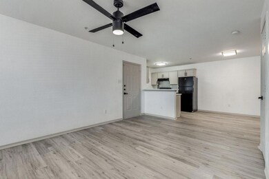 Unfurnished living room featuring light wood-type 