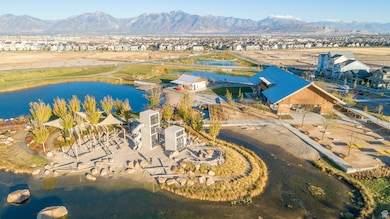 Aerial view of residential area featuring a water and mountain view