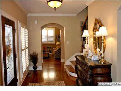 Elegant Foyer with vew into the Den/Study with fir