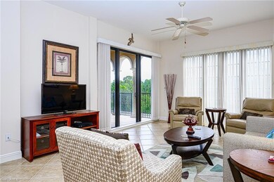 Living area with light tile patterned floors, ceil