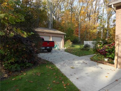 WOODED VIEW TO BACKYARD AND DETACHED 3 CAR GARAGE