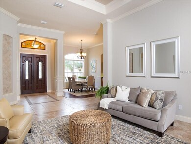 Grand Foyer inside with double entry doors and volume ceilings throughout!