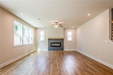 Unfurnished living room featuring hardwood / wood-