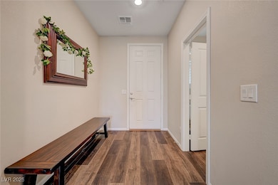 Hall with wood finished floors and baseboards