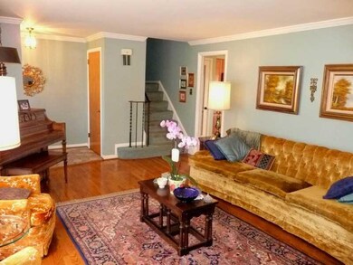 Living Room. Refinished hardwood floors, crown mol