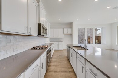 Kitchen with appliances with stainless steel finis