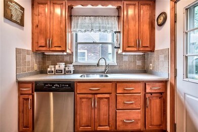 Maple cabinetry, corian counters, and ceramic floo