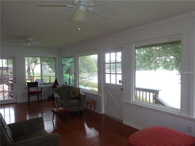 Large Florida room with light and bright lake view